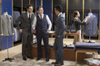 © Blue Jean Images - Confident fashion designer and businessmen talking