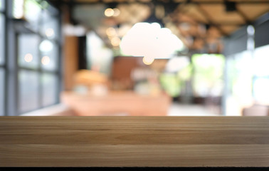 Empty dark wooden table in front of abstract blurred bokeh background of restaurant . can be used for display or montage your products.Mock up for space.