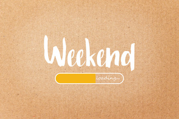 WEEKEND loading text on brown paper background