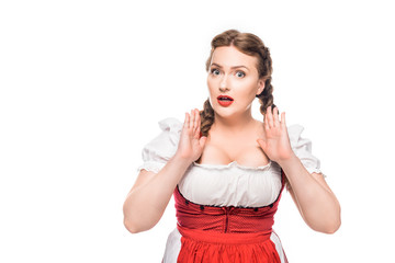 Wall Mural - shocked oktoberfest waitress in traditional bavarian dress gesturing by hands isolated on white background