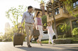 © Blue Jean Images - Happy young family going for vacation