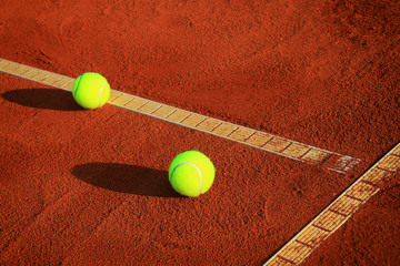 Wall Mural - Tennis balls on a tennis clay court