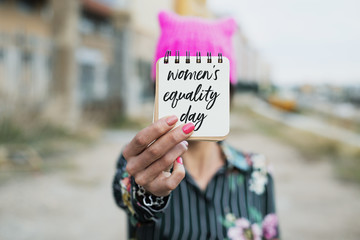 Wall Mural - woman with pussyhat and text womens equality day