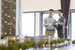 © Blue Jean Images - Realtor showing architectural model to young man