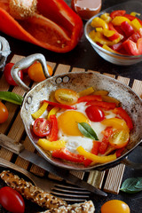 Wall Mural - Fried egg with a bell pepper and tomatoes