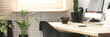 © Photographee.eu - Coffee cup, creative clock and a desktop computer on a wooden desk in a sunny workspace interior with plants