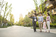 © Blue Jean Images - Happy young family talking with realtor