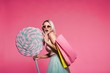 © veles_studio - Model posing with with sweets and shopping bags