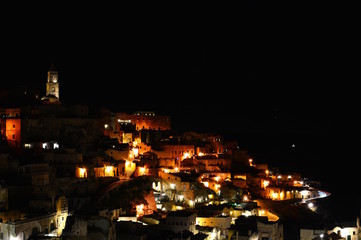 Wall Mural - Panoramic view of ancient town of Matera (Sassi di Matera) by night. Basilicata, Italy.