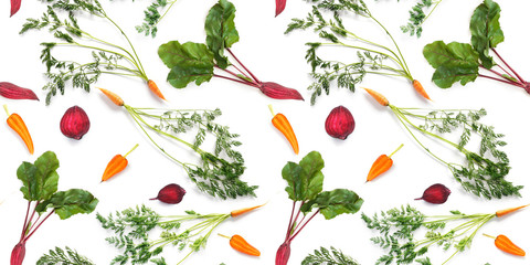 Wall Mural - Seamless pattern of fresh carrots with green tops and beetroot with leaves isolated on white background, top view. Creative food background.