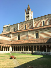 Wall Mural - Cloister of Church of San Zeno Maggiore Basilica with bell tower, Verona, UNESCO World Heritage Site, Veneto, Italy,Christian Basilica of Romanesque times. The cloister in Romanesque style