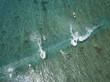 © Cavan Images - Aerial view of people surfing on sea at Maldives during sunny day