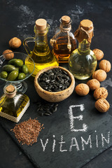 Wall Mural - Food containing vitamin E. Oil and seeds rich in vitamin E. Selective focus.