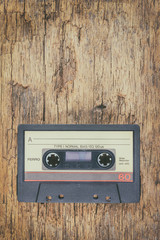 Wall Mural - old audio compact cassette on wood