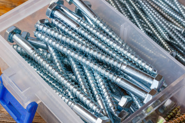 Long hexagon head bolts for fastening wooden structures in storage box cells closeup