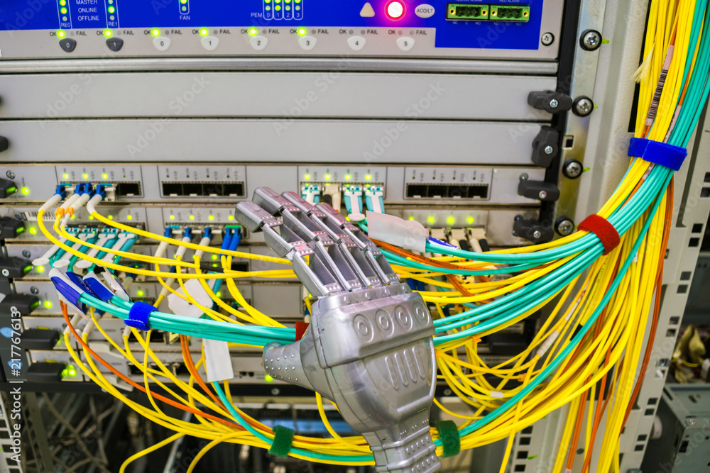 The robot arm switches optical Internet patchcords in the server room ...