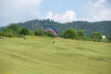 Paragliders on the meadow. Slovakia