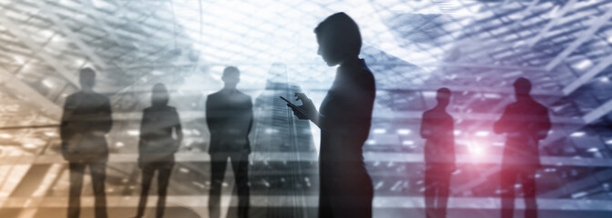 Wall Mural - Silhouettes of people walking in the street near skyscrapers and modern office buildings. Multiple exposure blurred image. Economy, finances, business concept illustration. Conseptual. 