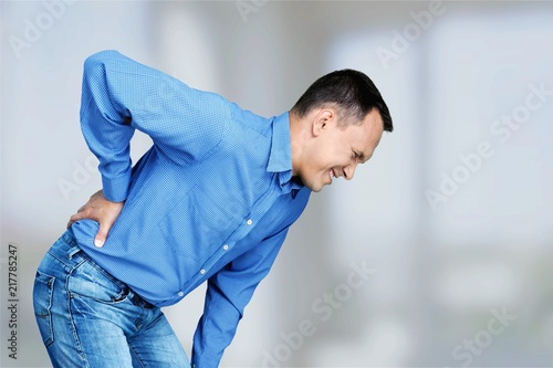 Cuadros en Lienzo Mature man with backache isolated on white