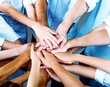 © BillionPhotos.com - Group of people stacking hands together