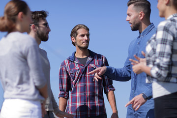 Wall Mural - closeup .a team of friends is discussing