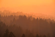 Smoke from the summer 2018 California wildfires glows under the setting sun