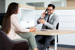 © zorandim75 - Business man speaking on the phone while in a meeting