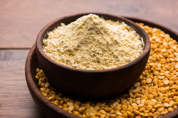 Besan, Gram or chickpea flour or powder is a pulse flour made from a variety of ground chickpea known as Bengal gram. popular ingredient for Pakora/pakoda or bajji snack. Selective focus