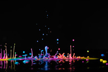 Abstract Sculptures Of Colorful Splashes Of Paint. Dancing Liquid On A Black Background. Ink Water Splash. Color Explosion.