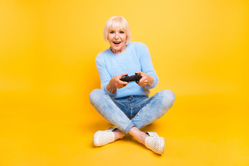 Close up portrait of young soul granny with toothy smile playing