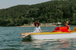 © Newman Studio - Couple in love enjoying boating in the lake. Portrait of young man and woman pedal boating on the river.