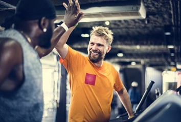 People exercising at fitness gym