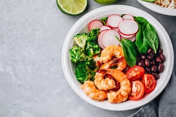 Spicy Shrimp Burrito Buddha Bowl with wild rice, spinach, radish,  tomatoes, black beans and broccoli