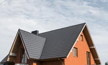 Modern Roof Covered With Tile Effect PVC Coated Brown Metal Roof Sheets.