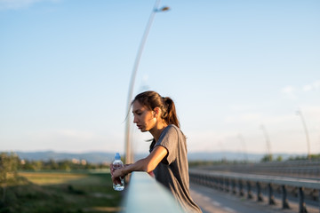 Wall Mural - Young Woman resting after working out