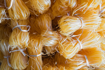 Raw fresh noodles in Thai style background. Ingredient for cooking.