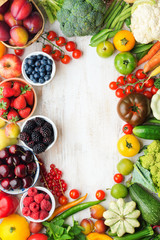 Wall Mural - Healthy summer fruits vegetables berries arranged in a frame, cherries peaches strawberries cabbage broccoli cauliflower squash tomatoes carrots beetroot, copy space, top view, selective focus