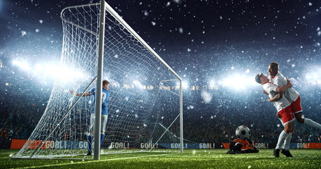 Intense soccer moment in front of the goal on the professional soccer stadium.