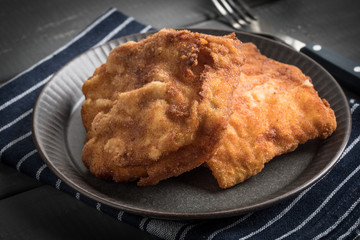 Two fried cod fillet pieces.