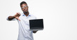 © Krakenimages.com - Young african american businessman using computer laptop with angry face, negative sign showing dislike with thumbs down, rejection concept