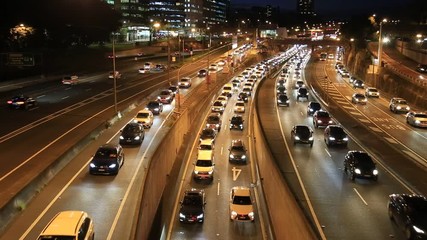 Poster - Dark night heavy traffic on Warringah freeway in Sydney’s North Sydney suburb at the entrance to the Sydney Harbour bridge and Harbour tunnel.
