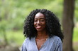© kosim - Content modern black woman smiling charmingly