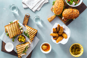 Canvas Print - Different snacks Grilled sandwich nuggets top view Outdoor food