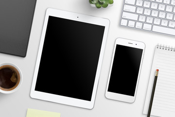 Aufkleber - Tablet and smart phone with blank screen for mockup on office desk surrounded with office supplies. Top view.