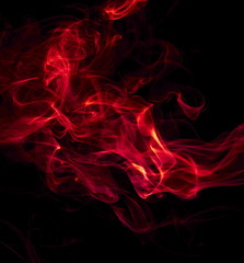 Red smoke on black background