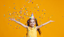 Happy Birthday Child Girl With Confetti On Yellow Background