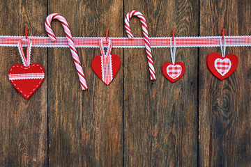 Wall Mural - Christmas Candy Canes with Christmas decoration on old wooden boards.