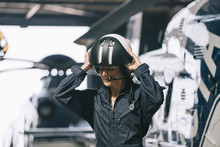 Pilot Girl Poses With Her Helicopter Wearing Helmet