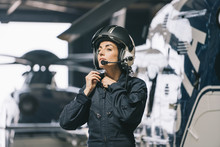 Pilot Girl Poses With Her Helicopter Wearing Helmet
