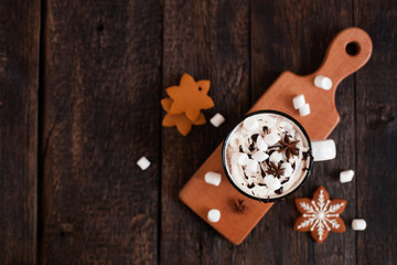 Mug of hot chocolate or cocoa with Christmas cookies and marsmallow